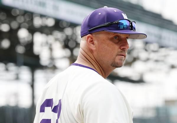 Northwestern ba<em></em>seball coach Jim Foster heads back to the dugout for a game against Notre Dame at Wrigley Field on May 16, 2023.